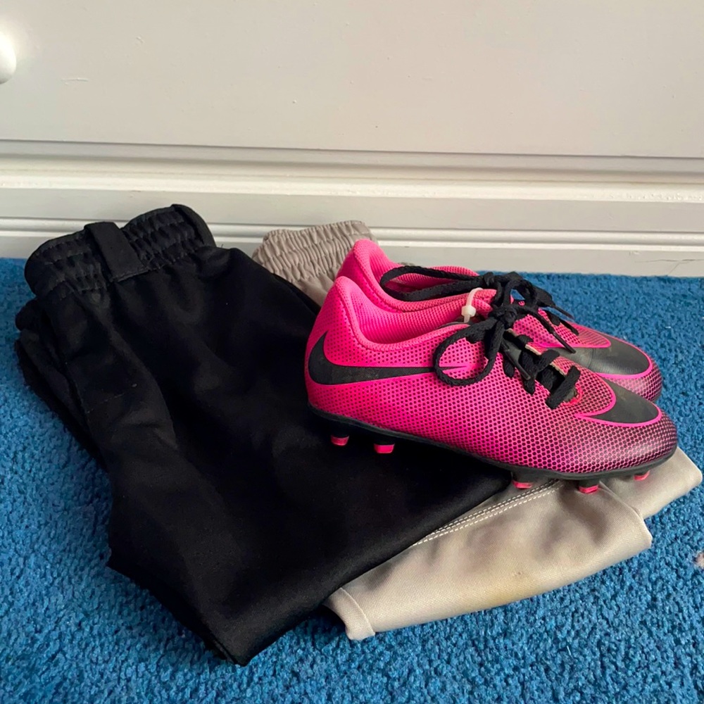 T-ball/softball cleats and 2 pairs pants